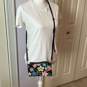 Like new Dooney and Bourke Crossbody wallet without tags.